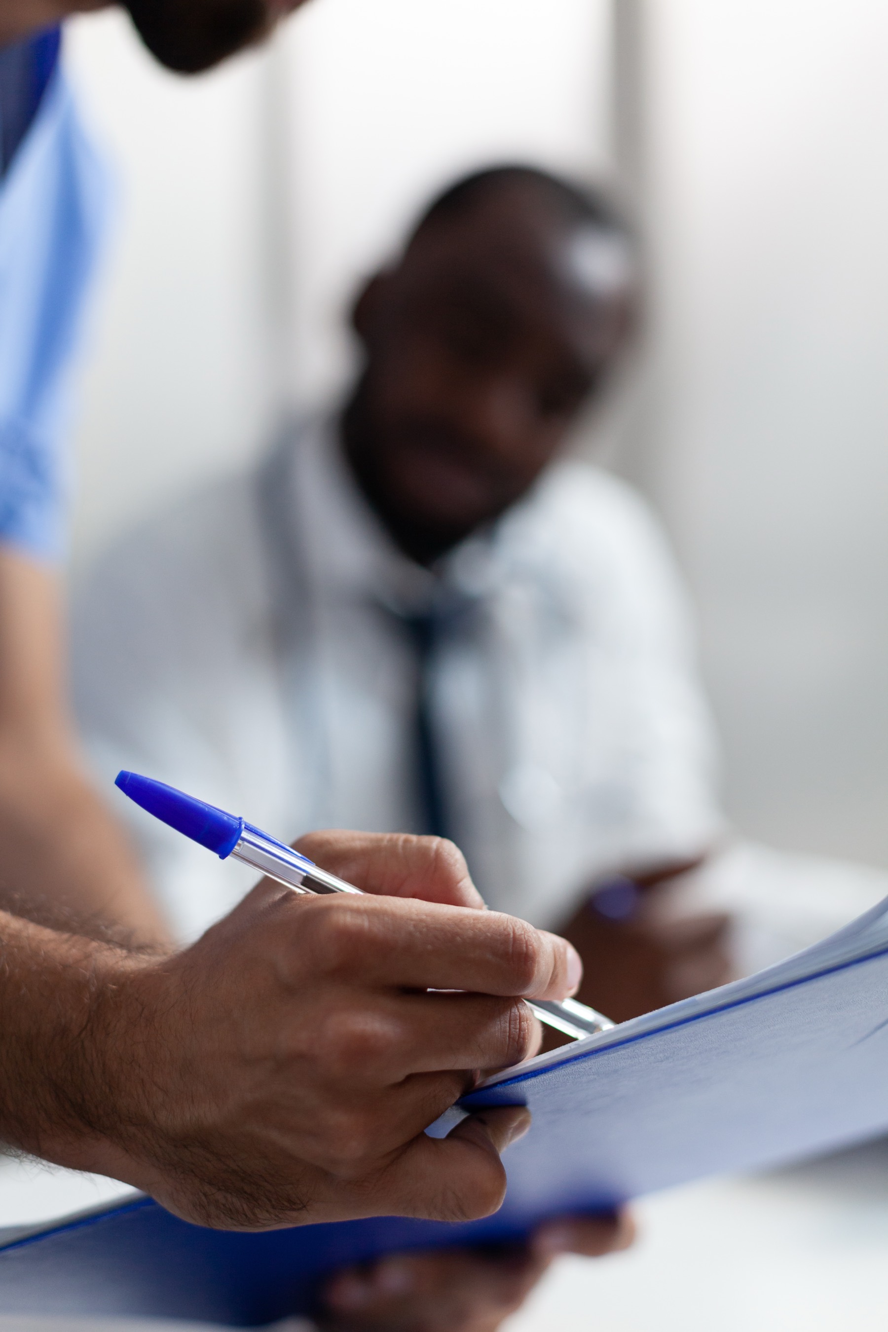 Clinician completing compliance documentation