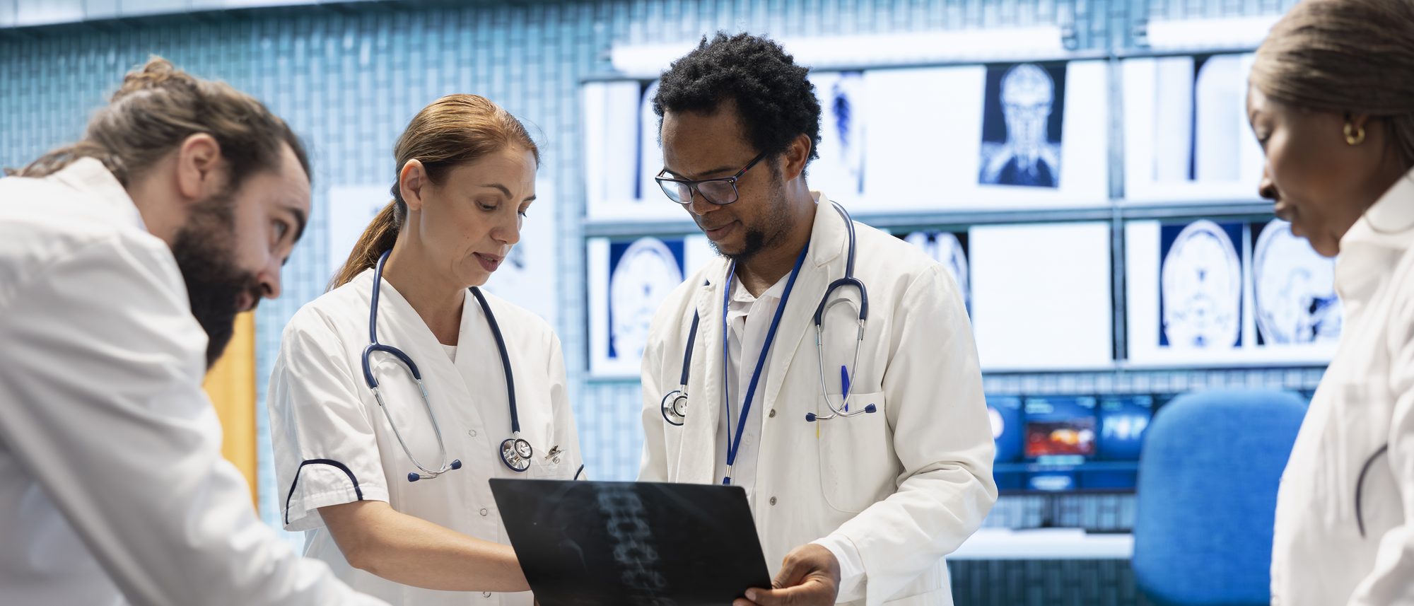A clinical team reviewing diagnostic imaging together